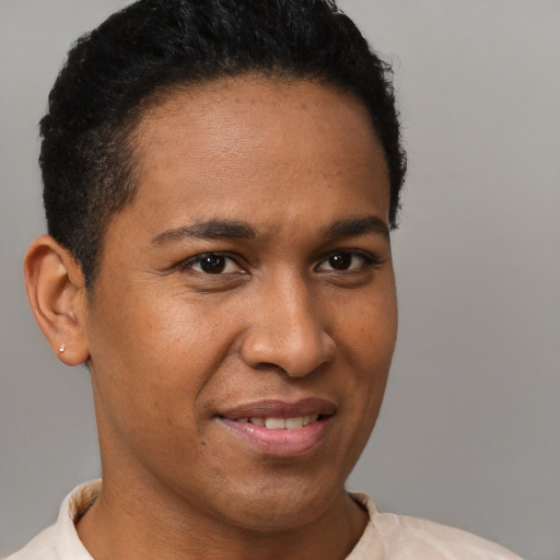 Joyful black young-adult male with short  brown hair and brown eyes
