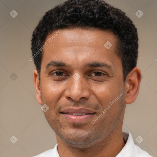 Joyful latino adult male with short  black hair and brown eyes