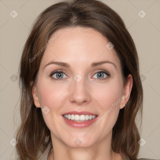 Joyful white young-adult female with medium  brown hair and blue eyes