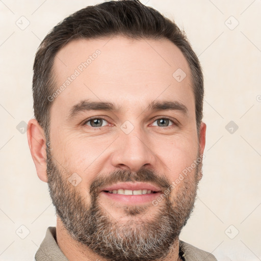 Joyful white adult male with short  brown hair and brown eyes