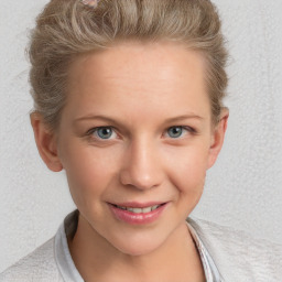 Joyful white young-adult female with short  brown hair and blue eyes