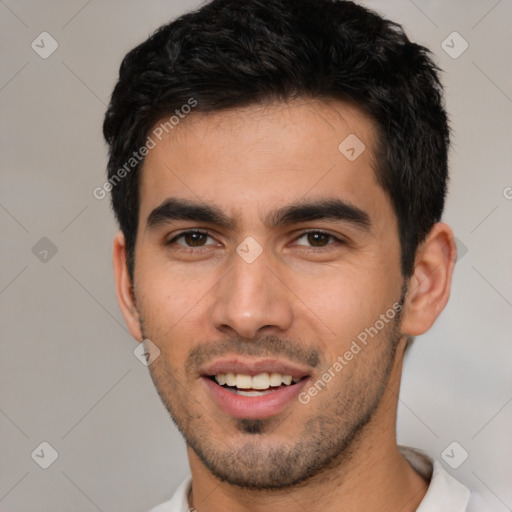 Joyful white young-adult male with short  black hair and brown eyes