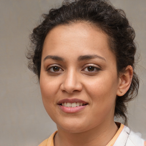 Joyful white young-adult female with medium  brown hair and brown eyes