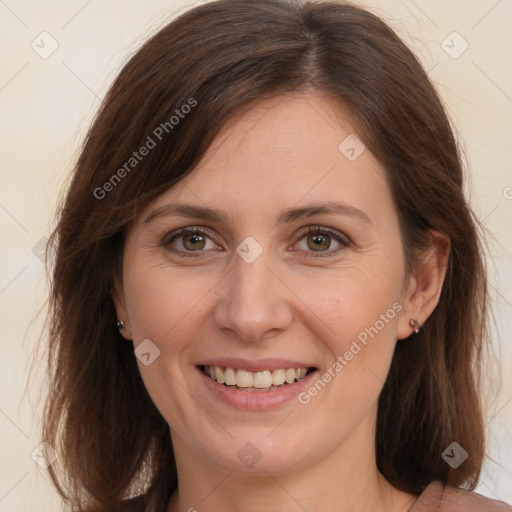 Joyful white adult female with medium  brown hair and brown eyes