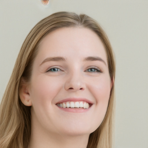 Joyful white young-adult female with long  brown hair and blue eyes