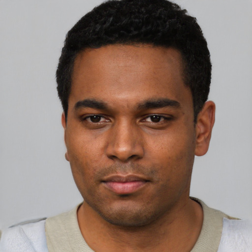Neutral black young-adult male with short  black hair and brown eyes