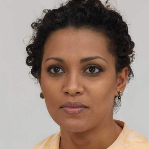 Neutral black young-adult female with short  brown hair and brown eyes