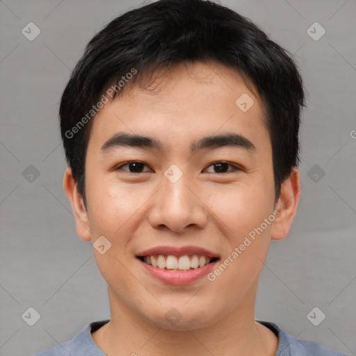 Joyful asian young-adult male with short  black hair and brown eyes