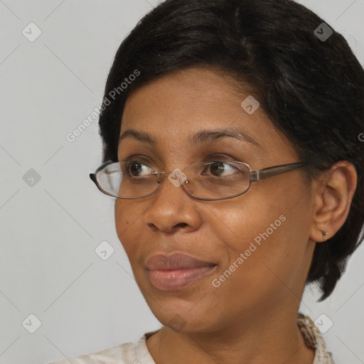 Joyful black adult female with short  brown hair and brown eyes