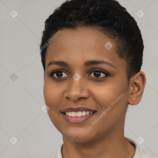 Joyful black young-adult female with short  black hair and brown eyes