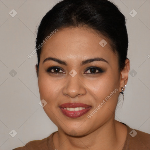 Joyful latino young-adult female with long  brown hair and brown eyes