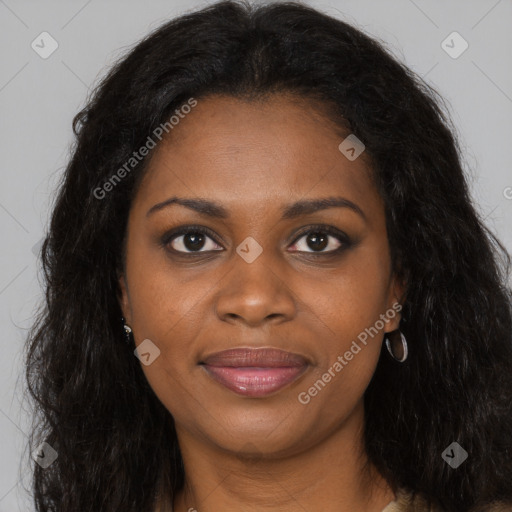 Joyful black young-adult female with long  brown hair and brown eyes