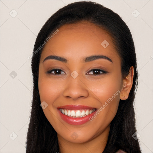 Joyful latino young-adult female with long  black hair and brown eyes