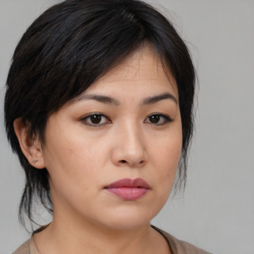 Neutral asian young-adult female with medium  black hair and brown eyes