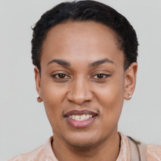 Joyful latino young-adult female with short  black hair and brown eyes