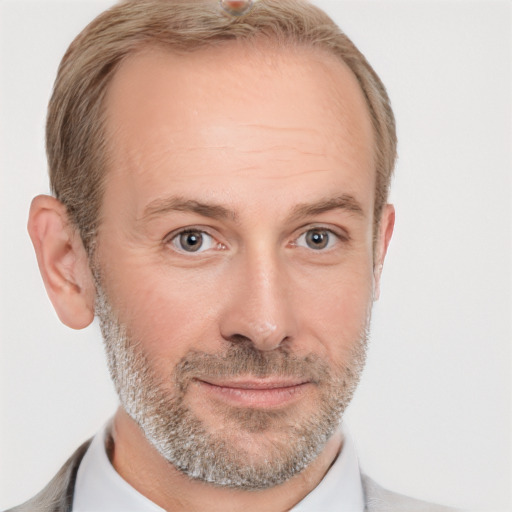 Joyful white adult male with short  brown hair and grey eyes