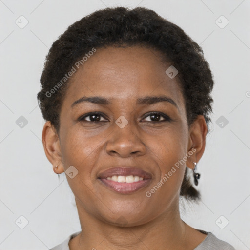 Joyful black young-adult female with short  brown hair and brown eyes