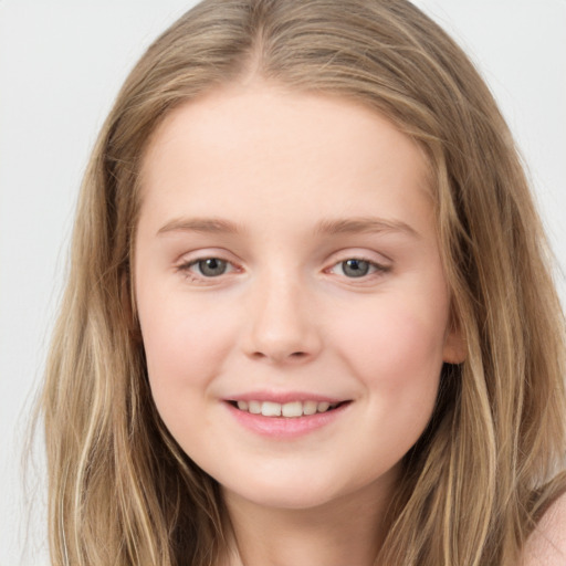 Joyful white child female with long  brown hair and brown eyes