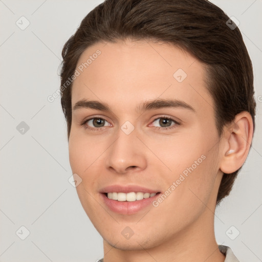 Joyful white young-adult female with short  brown hair and brown eyes