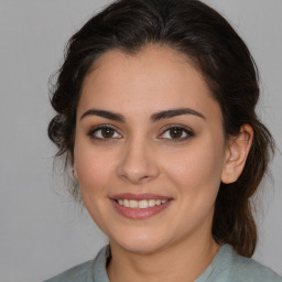 Joyful white young-adult female with medium  brown hair and brown eyes