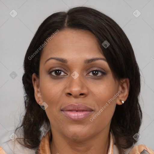 Joyful black adult female with medium  brown hair and brown eyes