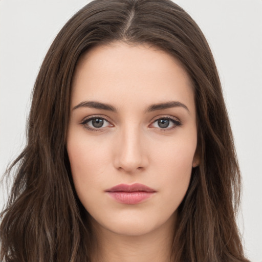 Neutral white young-adult female with long  brown hair and brown eyes