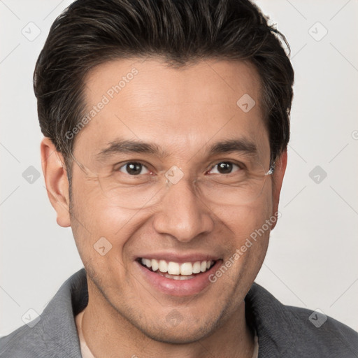 Joyful white adult male with short  brown hair and brown eyes