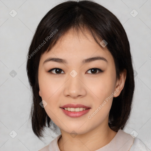 Joyful asian young-adult female with medium  black hair and brown eyes