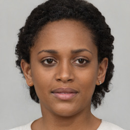 Neutral black young-adult female with short  brown hair and brown eyes