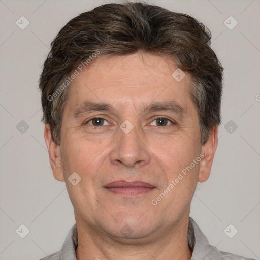 Joyful white adult male with short  brown hair and brown eyes