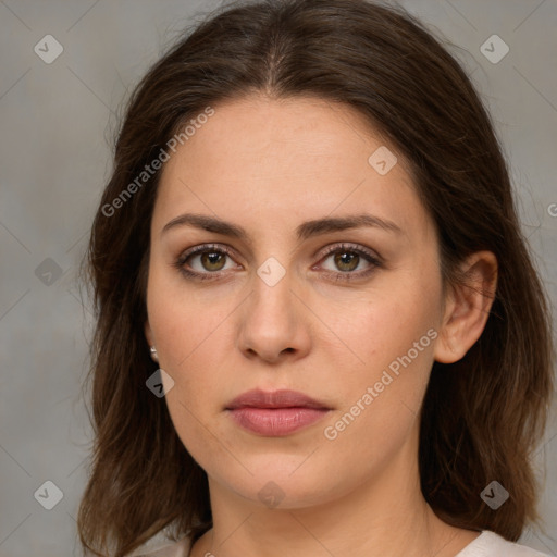 Joyful white young-adult female with medium  brown hair and green eyes