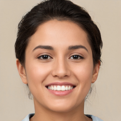 Joyful white young-adult female with medium  brown hair and brown eyes