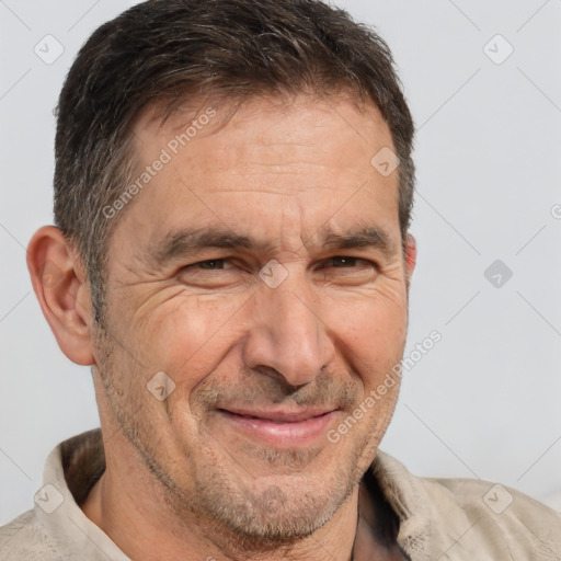 Joyful white middle-aged male with short  brown hair and brown eyes