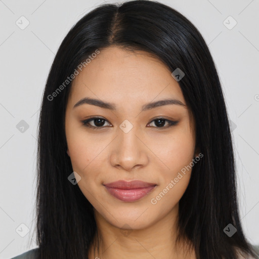 Joyful latino young-adult female with long  black hair and brown eyes