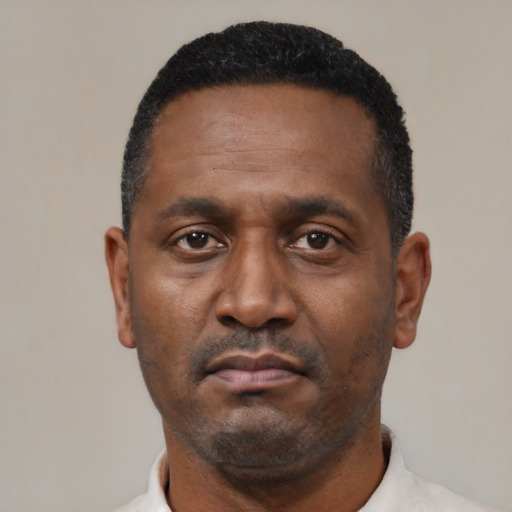 Neutral black adult male with short  black hair and brown eyes