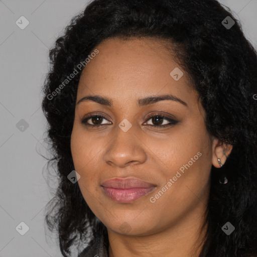 Joyful black young-adult female with long  black hair and brown eyes