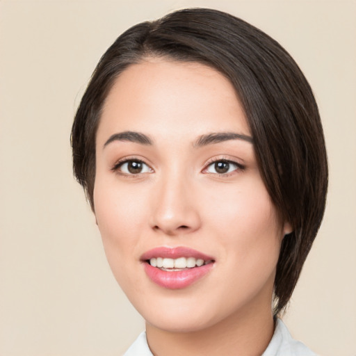 Joyful white young-adult female with medium  black hair and brown eyes