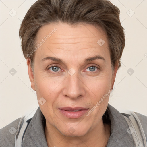 Joyful white adult female with short  brown hair and brown eyes