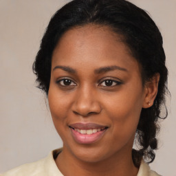 Joyful black young-adult female with medium  brown hair and brown eyes