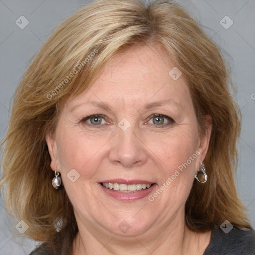 Joyful white adult female with medium  brown hair and blue eyes