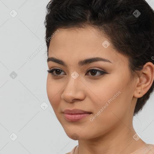 Joyful latino young-adult female with long  brown hair and brown eyes