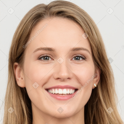 Joyful white young-adult female with long  brown hair and blue eyes