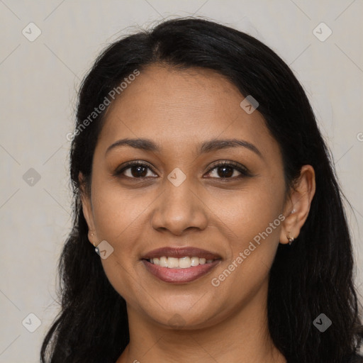 Joyful latino young-adult female with long  black hair and brown eyes