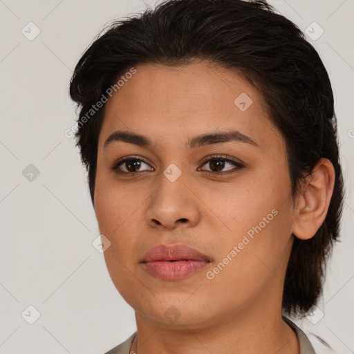 Joyful latino young-adult female with medium  brown hair and brown eyes