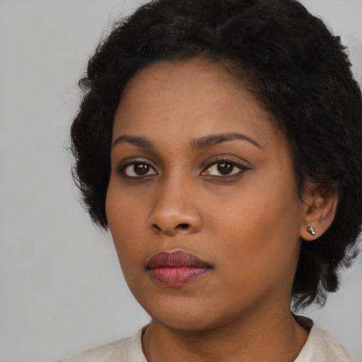 Neutral black young-adult female with long  black hair and brown eyes