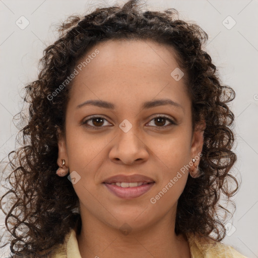 Joyful black young-adult female with long  brown hair and brown eyes