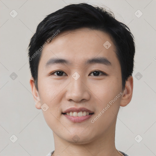 Joyful asian young-adult male with short  black hair and brown eyes