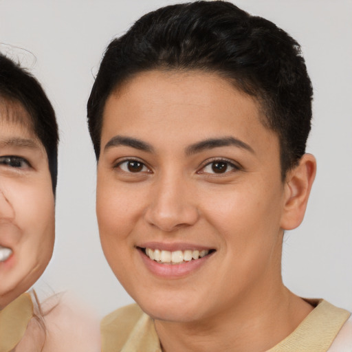 Joyful asian young-adult female with short  brown hair and brown eyes