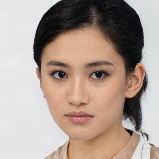 Neutral asian young-adult female with medium  black hair and brown eyes