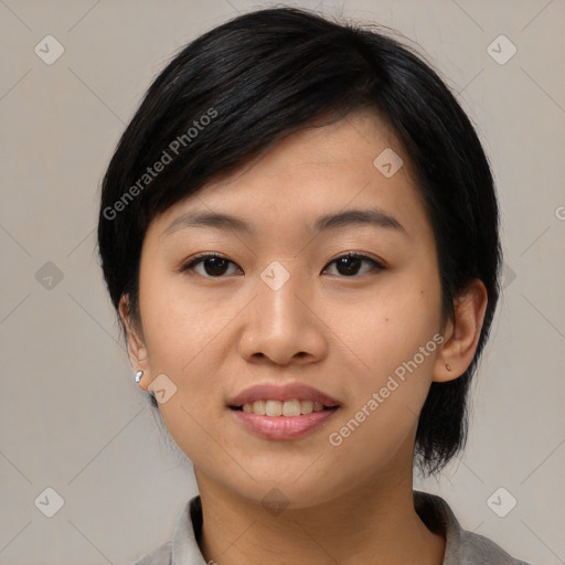 Joyful asian young-adult female with medium  black hair and brown eyes